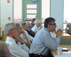 Senator Jeff Bingaman, UNM Provost Chaouki Abdallah listen to presentations