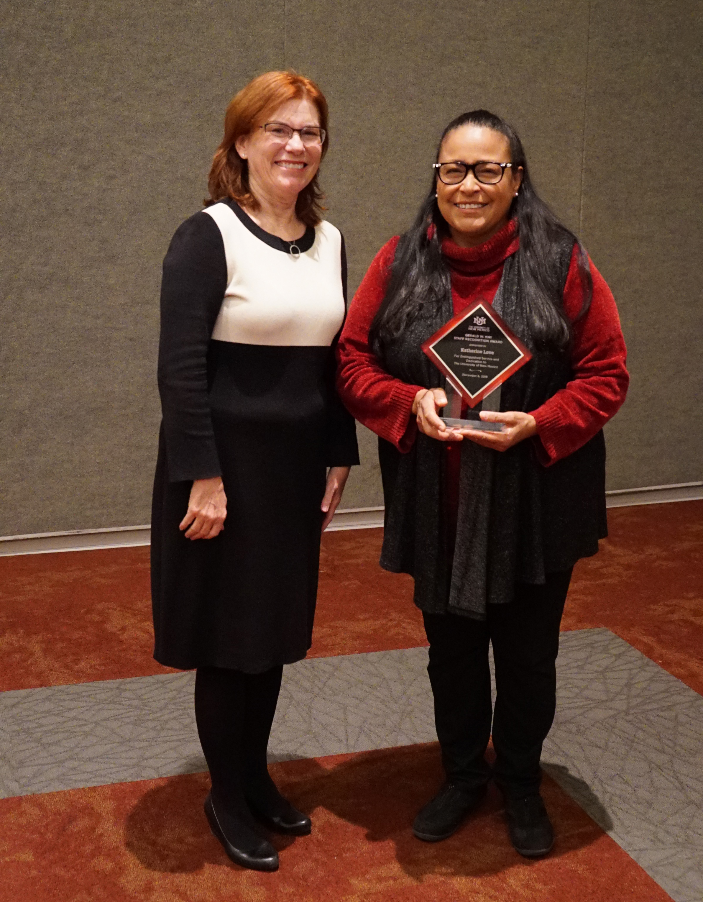 UNM President Garnett Stokes stands with Katherine Love in this photo