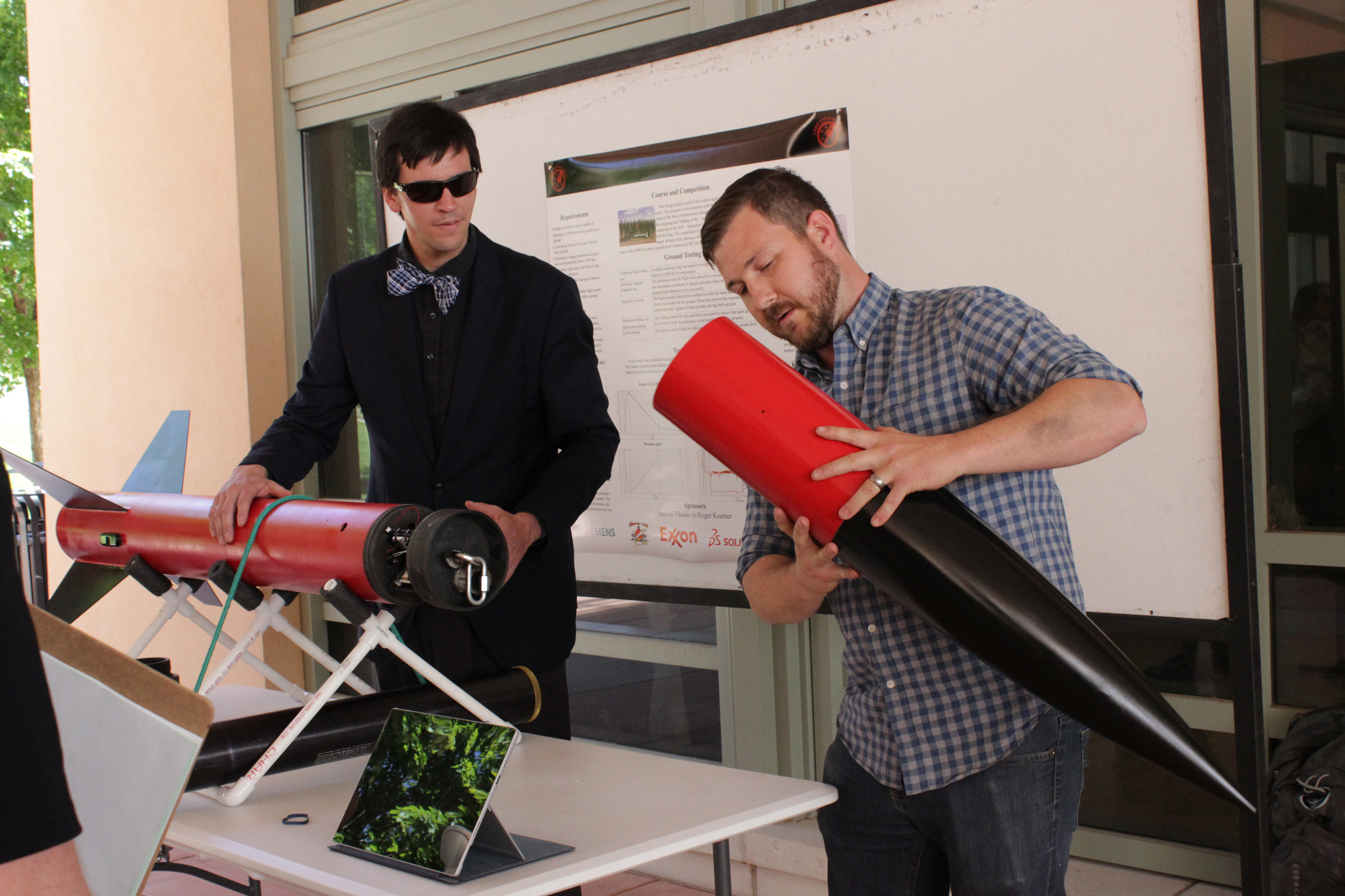 2 students working on rocket