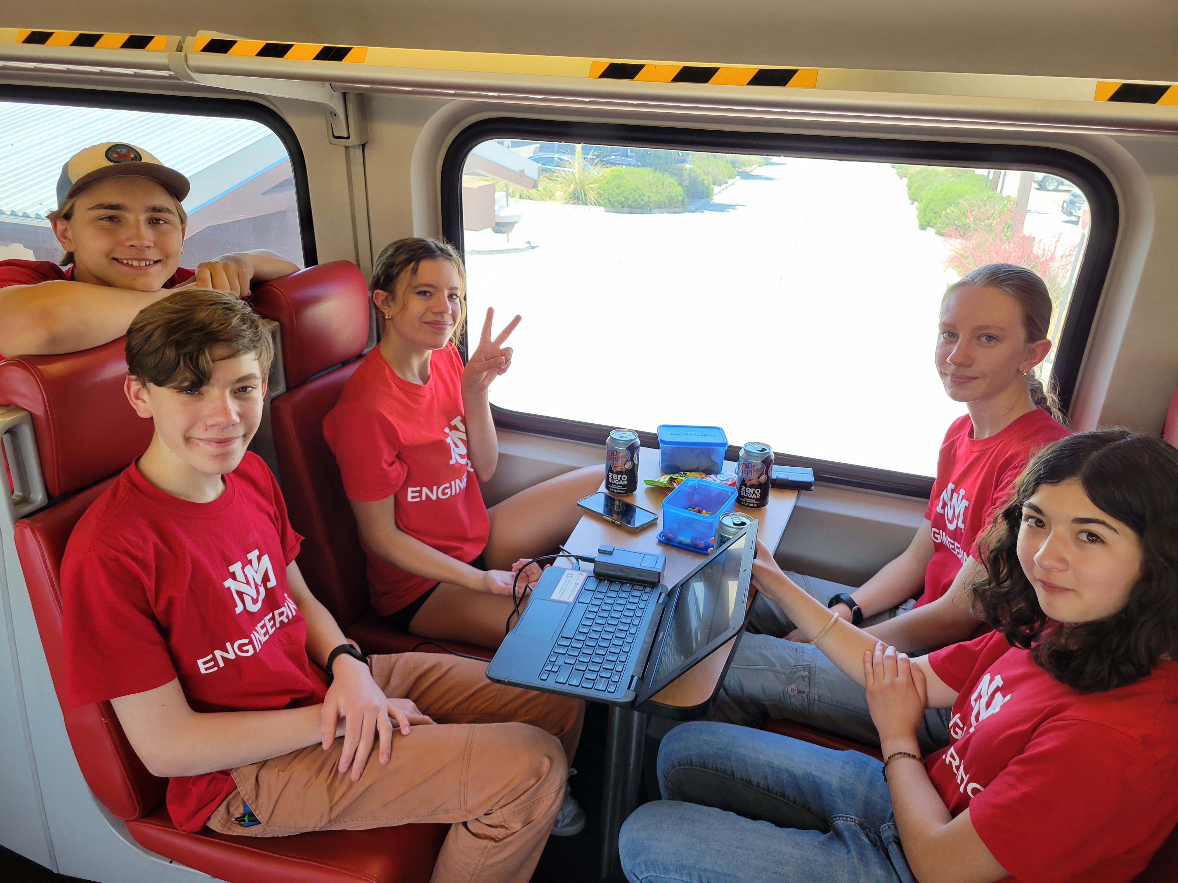 photo: Students participating in the Smart Railroads program, riding the Rail Runner while collecting data.