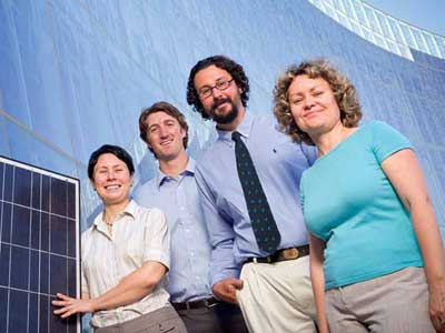 Dr. Olga Lavrova, PhD student Birk Jones, Dr. Andrea Mammoli, and Dr. Svetlana Poroseva, part of an international consortium studying sustainability, in front of the Aperture Center at Mesa del Sol.