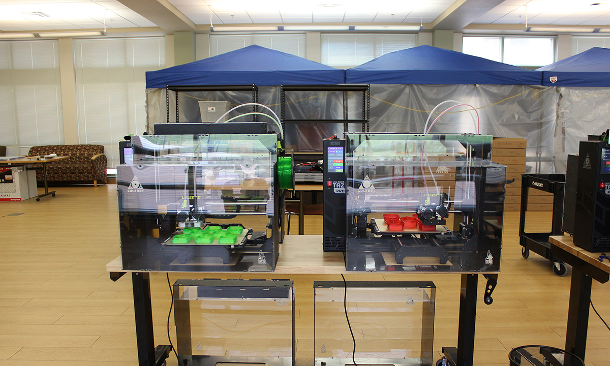 photo of two #D printing machines used to create masks
