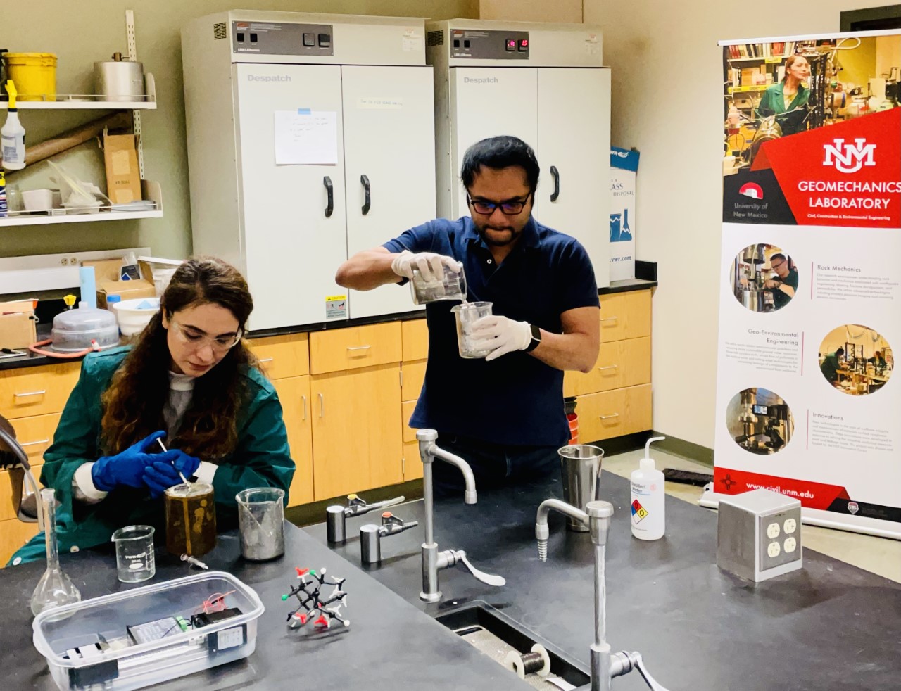 photo of two students working in a laboratory