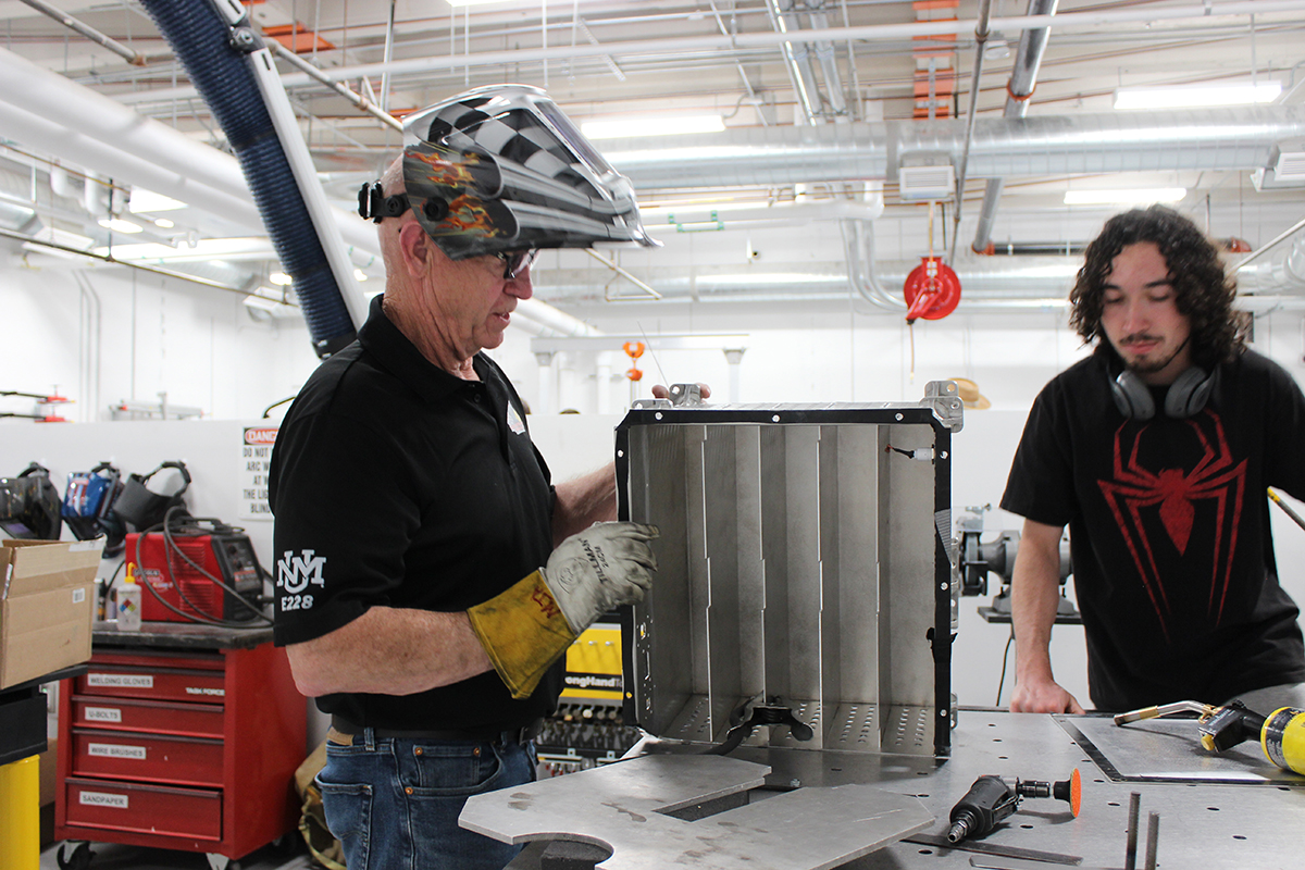 photo: Mike Arnold and student at work in the FSAE garage