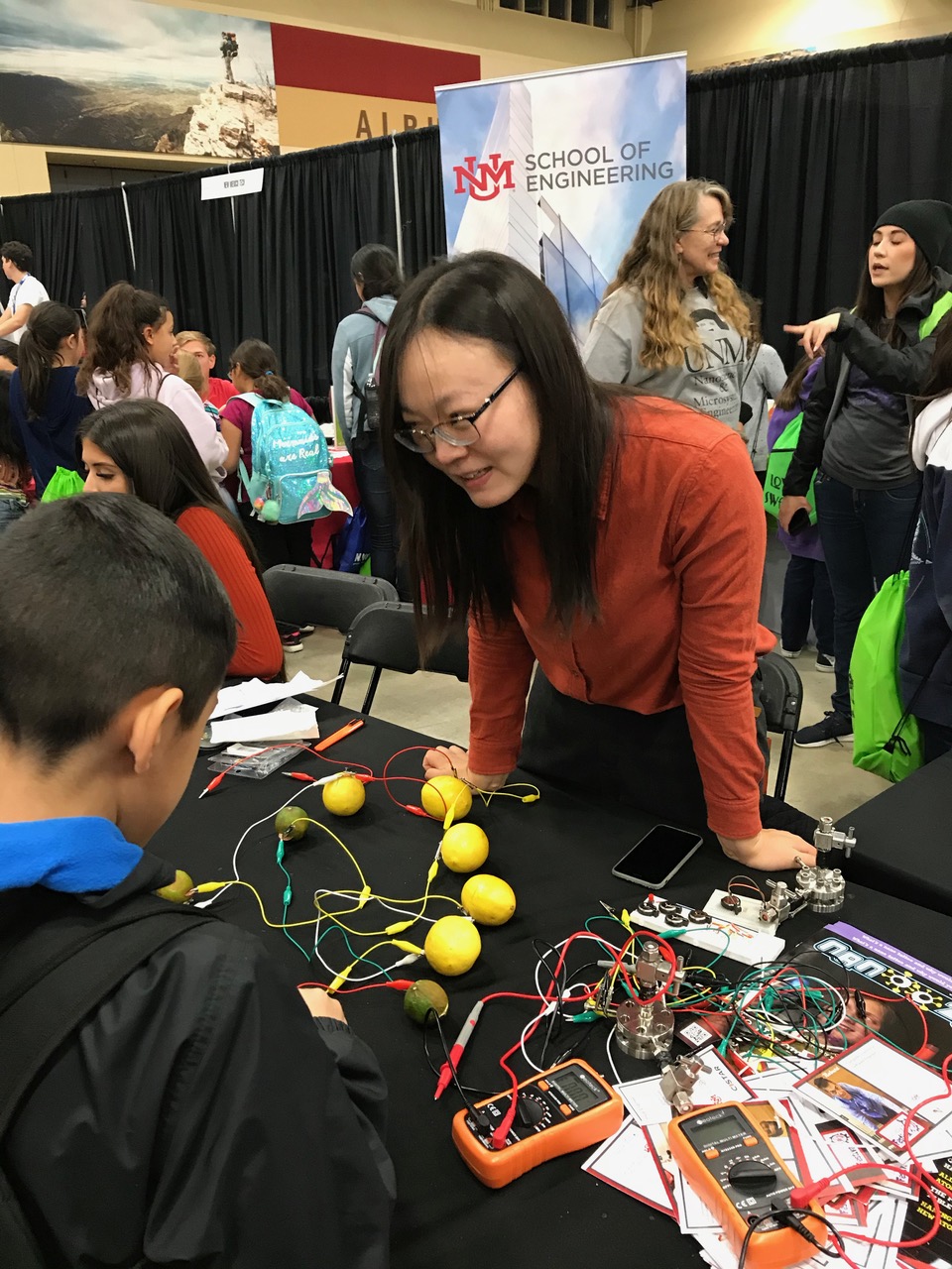 photo: Shuya Wei at an outreach event in 2019 that demonstrates some of her battery research with lemons.